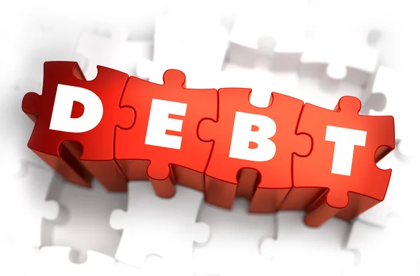 Dívida - Palavra branca em quebra-cabeças vermelhos . — Fotografia de Stock
