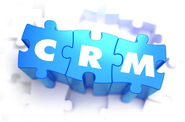 Crm-白色字上蓝色的谜题. — 图库照片