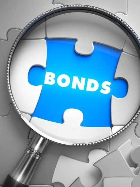 Bonds - Puzzle mit fehlendem Stück durch Lupe. — Stockfoto