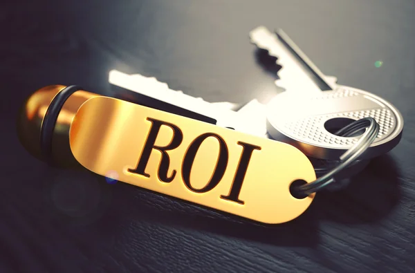 ROI scritto su Portachiavi dorato . — Foto Stock