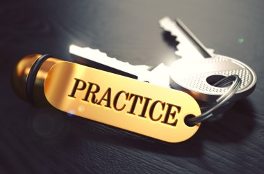 Practice - Bunch of Keys with Text on Golden Keychain.