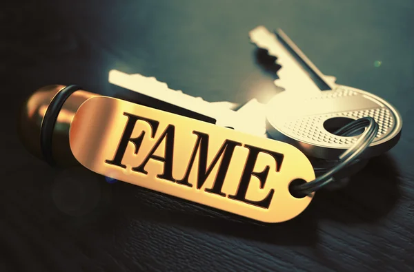 Fame written on Golden Keyring. — Stock fotografie
