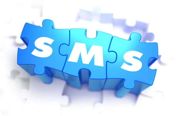 SMS - Texto sobre quebra-cabeças azuis . — Fotografia de Stock