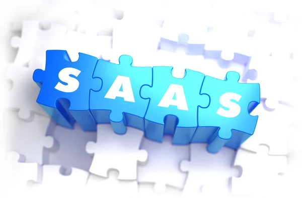 Saas - Text auf blauen Puzzles. — Stockfoto