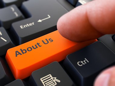Press Button About Us on Black Keyboard.
