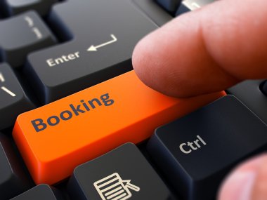 Press Button Booking on Black Keyboard.