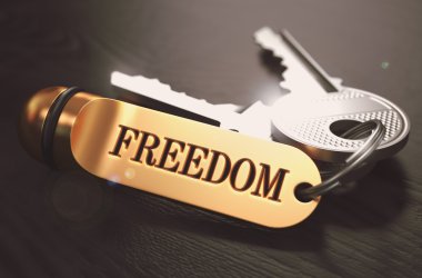 Keys to Freedom. Concept on Golden Keychain.