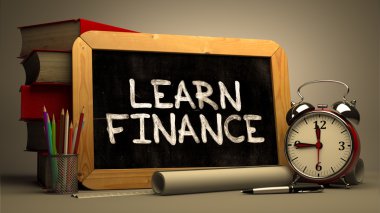 Handwritten Learn Finance on a Chalkboard.