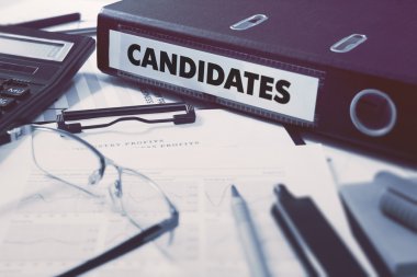 Candidates on Ring Binder. Blured, Toned Image. clipart