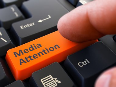 Media Attention - Written on Orange Keyboard Key.