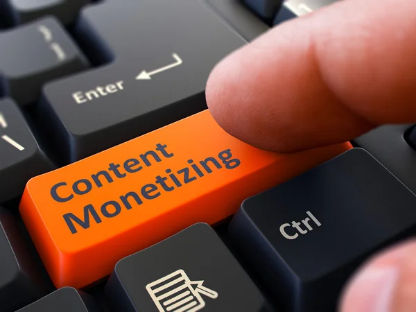 Content Monetizing - Clicking Orange Keyboard Button. — Stockfoto