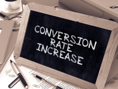Conversion Rate Increase - Chalkboard with Hand Drawn Text.