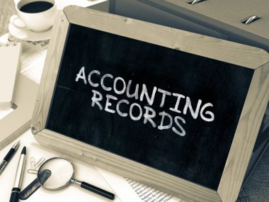 Hand Drawn Accounting Records Concept on Small Chalkboard.
