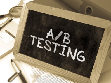 AB Testing Handwritten on Chalkboard.