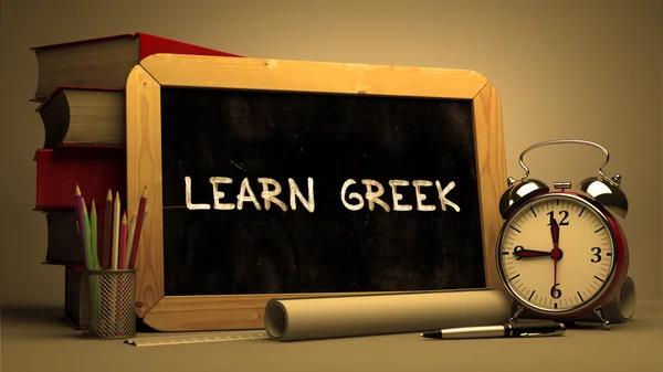 Hand Drawn Learn Greek Concept on Chalkboard. — Zdjęcie stockowe