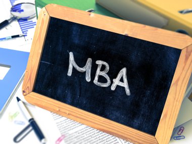 MBA Concept Hand Drawn on Chalkboard.