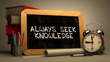Handwritten Always Seek Knowledge on a Chalkboard.