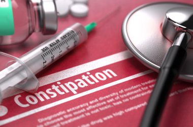 Constipation. Medical Concept on Red Background.