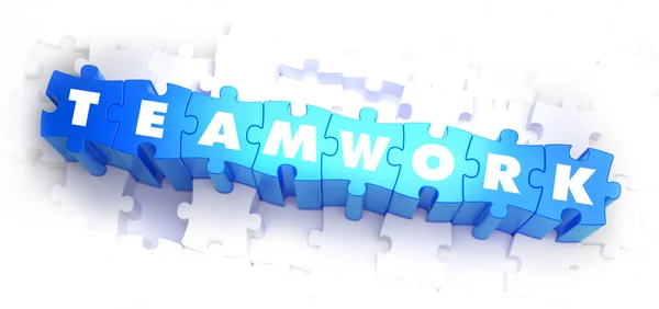 Teamwork - weißes Wort auf blauem Rätsel. — Stockfoto