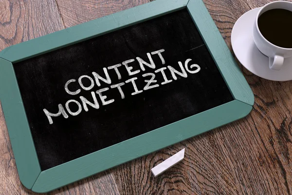 Content Monetizing Handwritten by White Chalk on a Blackboard. — Stockfoto