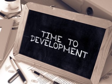 Time to Development - Inspirational Quote on Chalkboard.