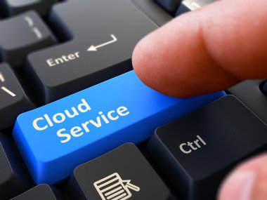 Pressing Blue Button Cloud Service on Black Keyboard.