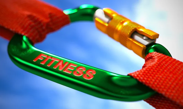 Fitness en mosquetón verde entre cuerdas rojas . — Foto de Stock