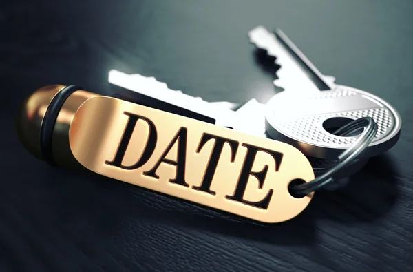 Keys with Word Date on Golden Label. — Stockfoto