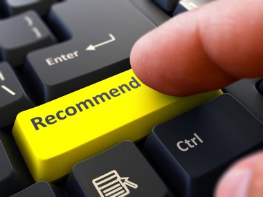 Finger Presses Yellow Keyboard Button Recommend.