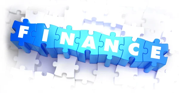 Finanzas - Palabra blanca sobre rompecabezas azules . — Foto de Stock