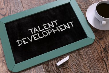 Talent Development Handwritten on Chalkboard.