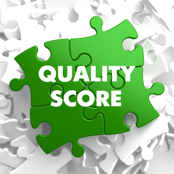 Qualität Score auf grünes Puzzle. — Stockfoto