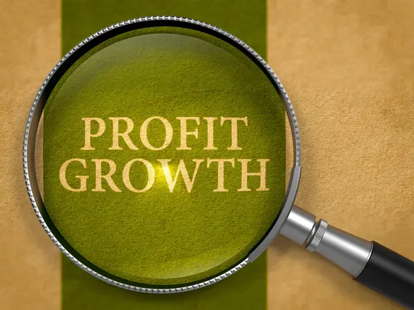 Profit Growth through Loupe on Old Paper. — Stok fotoğraf