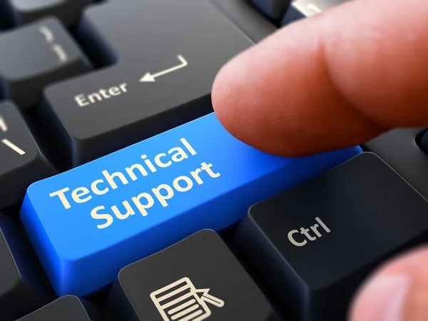 Finger drückt blaue Tastatur-Taste technische Unterstützung. — Stockfoto