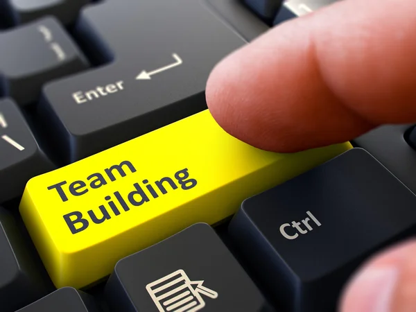 Finger Presses Yellow Keyboard Button Team Building. — Stock Photo, Image