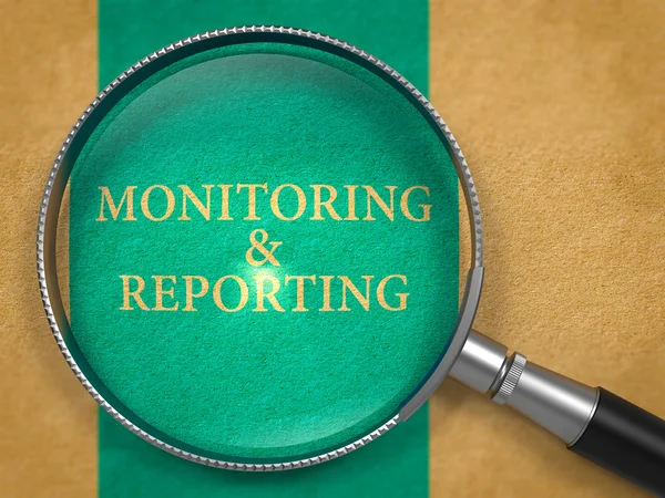 Monitoring and Reporting through Lens on Old Paper. — Stockfoto