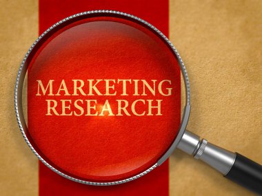 Marketing Research through Loupe on Old Paper.