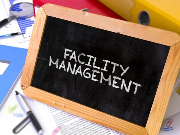 Facility Management - Chalkboard with Hand Drawn Text. — Stockfoto