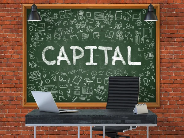 Capital on Chalkboard in the Office. — Stockfoto