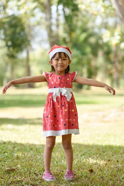 Little girl in Santa hat — Stock Photo, Image