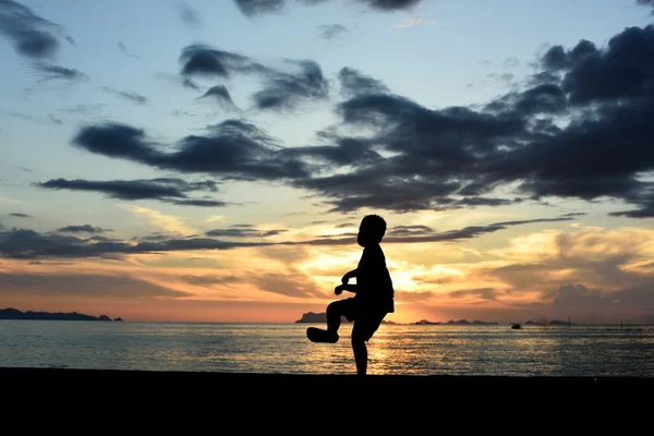 Silhouette of boy doing martial art — Stock Photo, Image