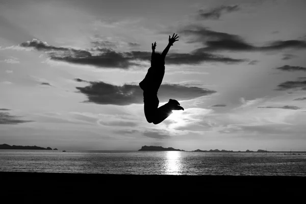 Silhouette of man jumping — Stock Photo, Image