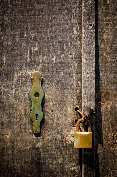 Old scratched wooden door — Stock Photo, Image