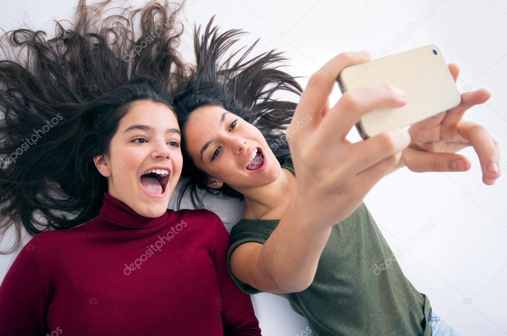 teenager girls taking selfie