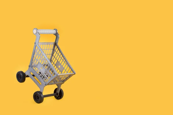 Plastic Toy Shopping Cart Yellow Background — Stock Photo, Image