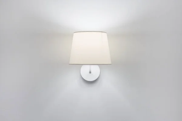 White elegant modern wall lamp with textile shade in interior — Stock Photo, Image