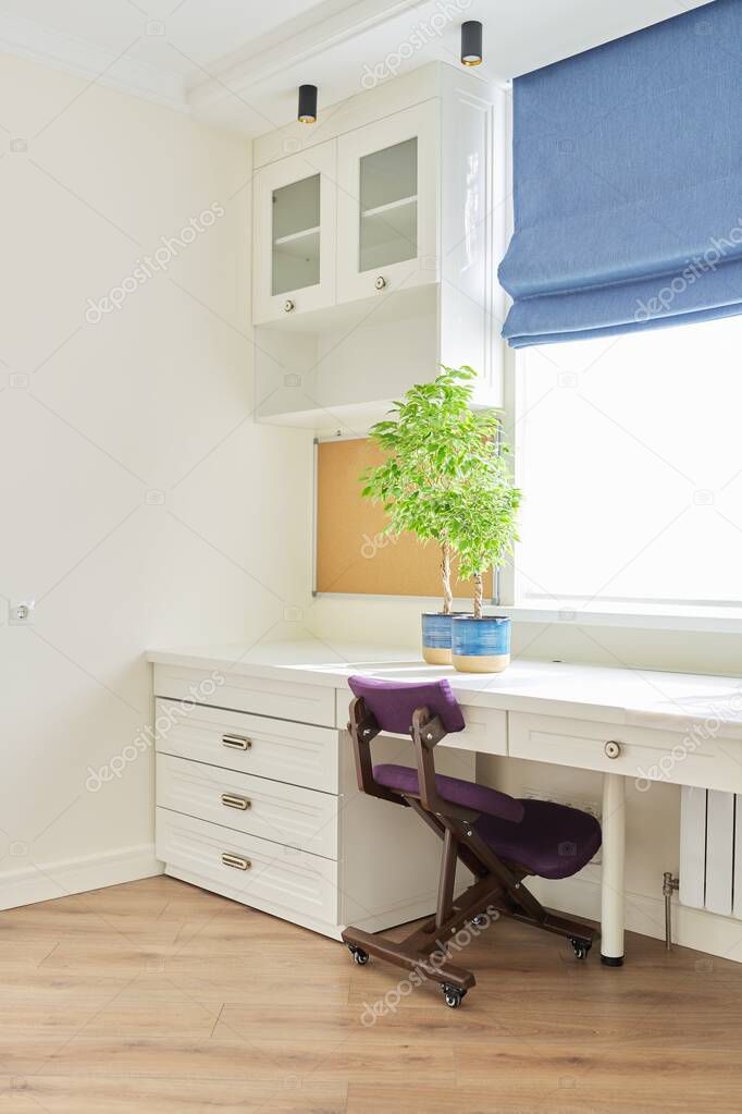 Orthopedic knee chair in the interior of childrens room, home office