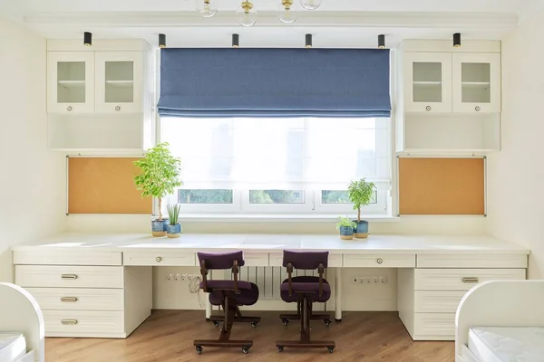 Interior of childrens room for two children in light colors