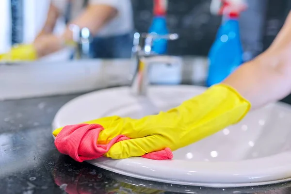 Close up of hands in gloves with detergent washing polishing washbasin — Stock Photo, Image