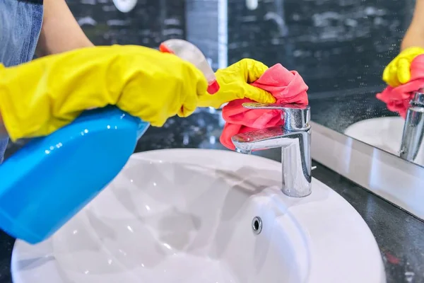 Close up of hands in gloves with detergent washing polishing washbasin, chrome sink — Stock Photo, Image